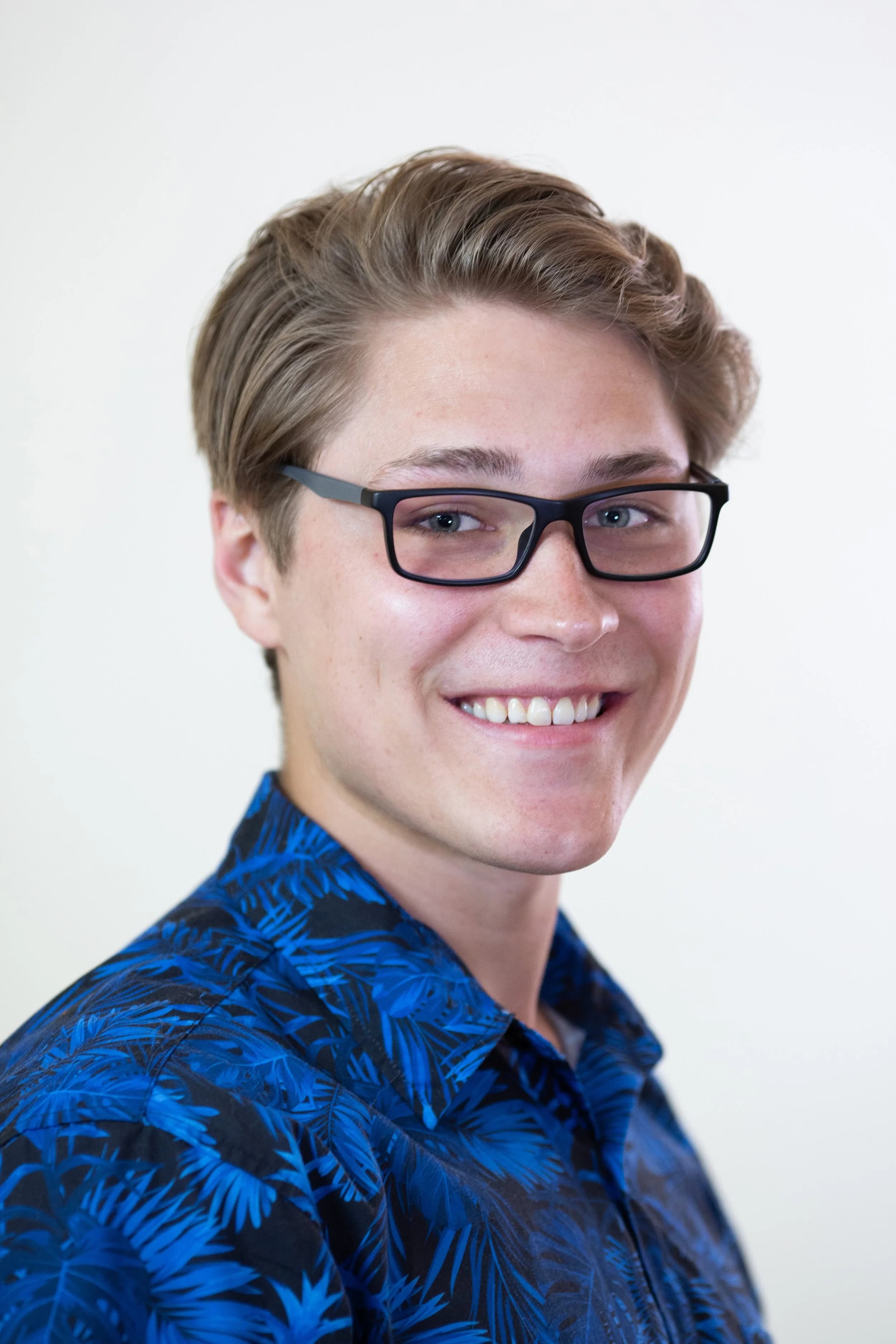 aidan helfant glasses smiling